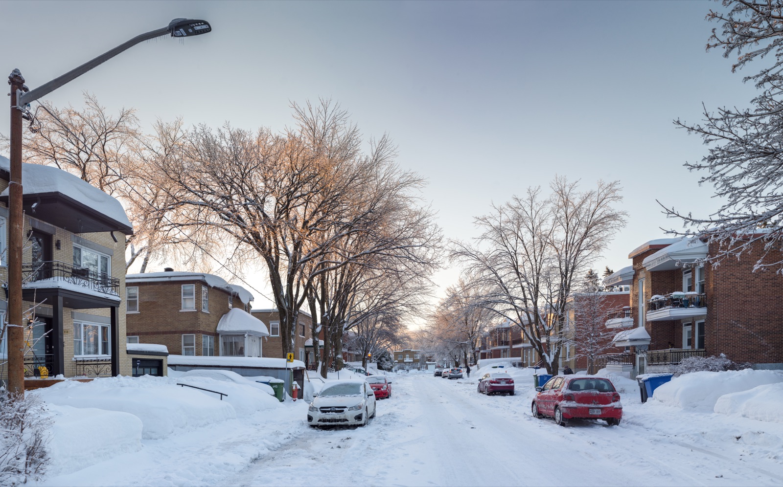 Vieux-Limoilou heritage triplex housing in winter snow north of the Saint-Charles river, Quebec City