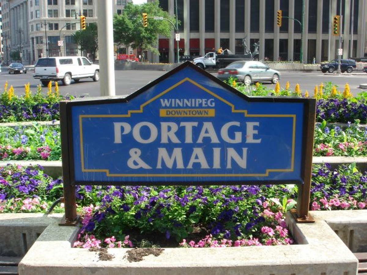 Portage and Main downtown Winnipeg with The Forks at the Red and Assiniboine confluence