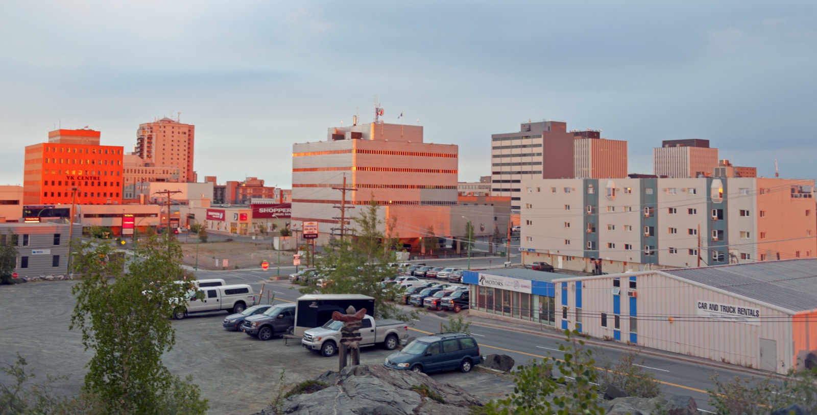 Downtown Yellowknife at sunset along 50th Avenue with the GNWT government core in late summer light